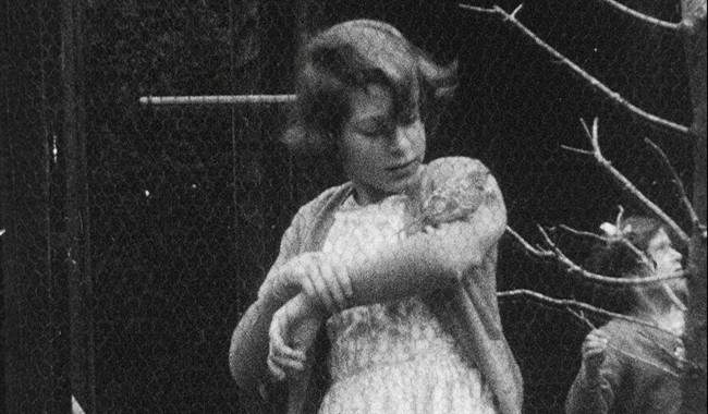This undated handout photo provided by HM The Queen shows the then Princess Elizabeth with a bird on her arm, in Britain.