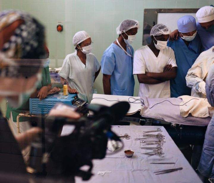 Global journalist Jayme Doll films a hernia surgery in Antananarivo, Madagascar. The patient is a two-year-old boy.