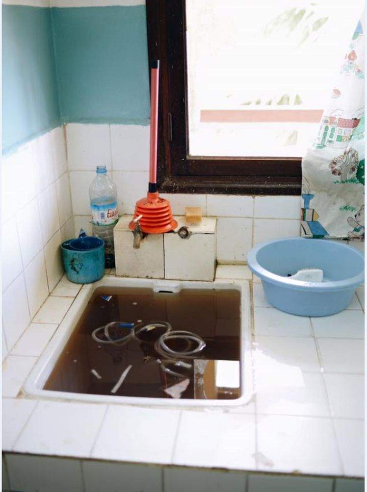 Catheters are soaking in a sink in preparation to be re-used. (Toamasina, Madagascar)