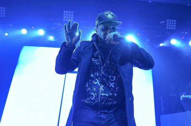 FILE- In this Feb. 12, 2015, file photo, rapper T.I. performs at HOT 97's "The Tip Off" at Madison Square Garden in New York. RCMP say a bodyguard for T.I. was stabbed early Tuesday at a Moncton concert. 