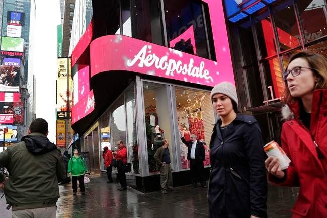 In this Wednesday, Dec. 2, 2015, file photo, women pass an Aeropostale clothing store in New York's Times Square. Aeropostale, once the vibrant epicenter of the U.S. mall scene, announced Wednesday, May 4, 2016, it is seeking Chapter 11 bankruptcy protection.
