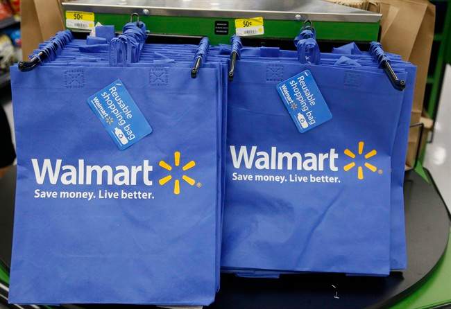 FILE - In this Thursday, Sept. 19, 2013, file photo, reusable shopping bags are offered for sale at a Wal-Mart Neighborhood Market, in the Chinatown district of Los Angeles.  