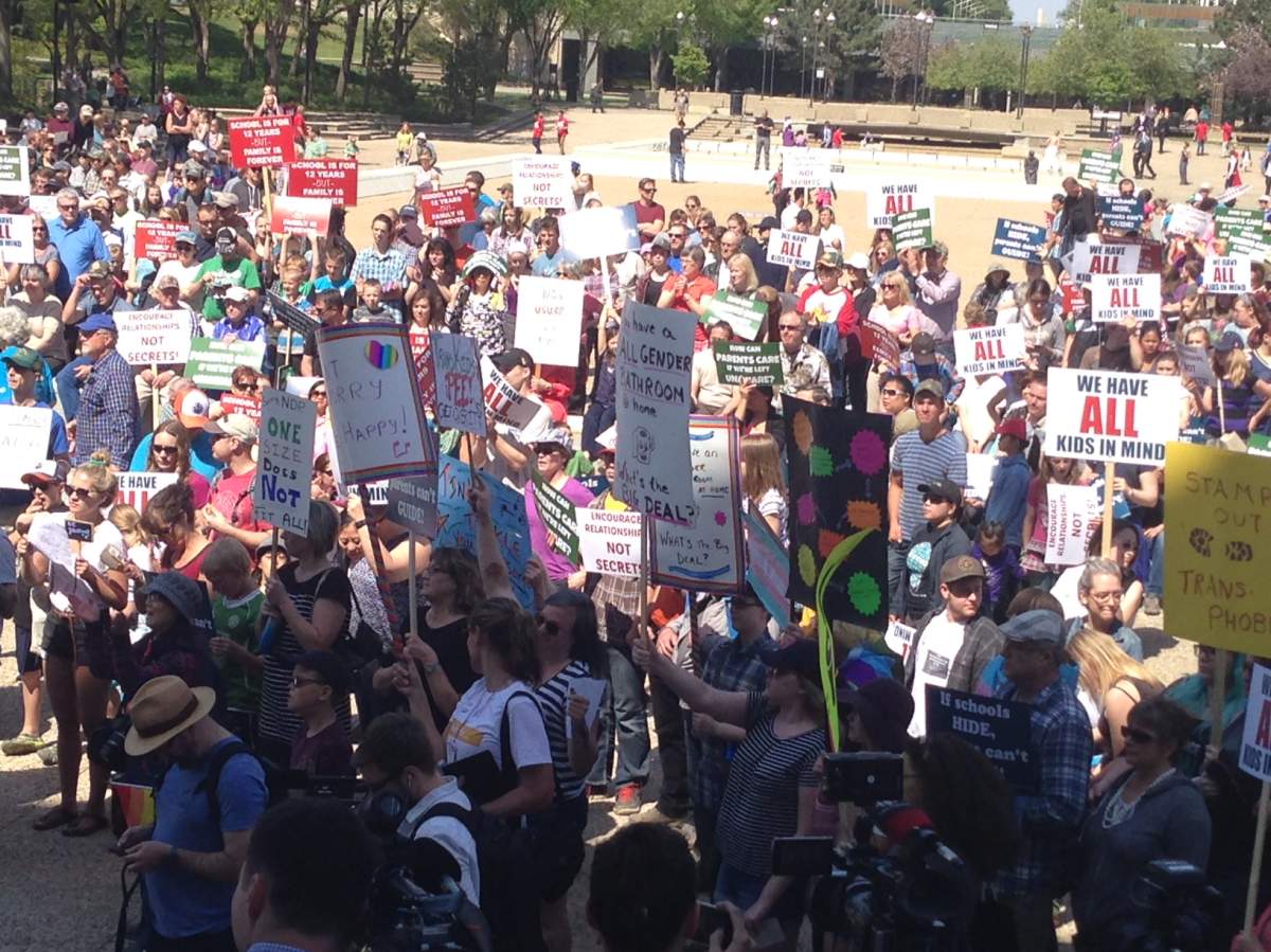 Two opposing rallies meet at the Alberta Legislature Saturday afternoon.