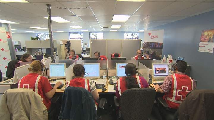 Volunteers are busy accepting donations for victims for the Fort McMurray fires at a Red Cross emergency call center in Montreal.
