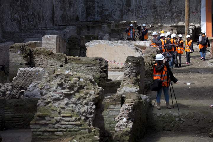 Media visit the site where ancient Roman ruins were discovered during work on a new underground line, in Rome, Monday, May 16, 2016.