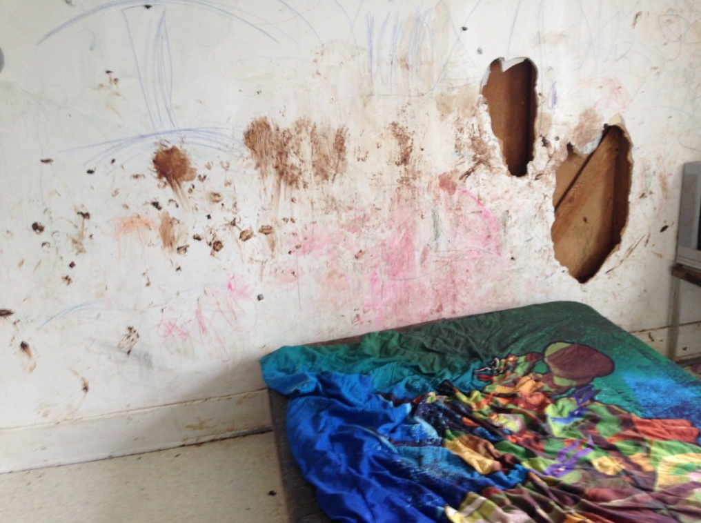 Feces is seen smeared on the damaged wall of a completely trashed rental property in Saint John. The landlord contacted Global News in 2016 about the damage to his property.