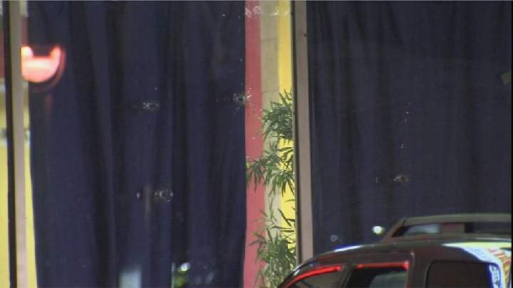 Bullet holes can be seen in the windows of a local restaurant in Saint-Michel. Sunday, May 29, 2016. Photo Courtesy of TVA.