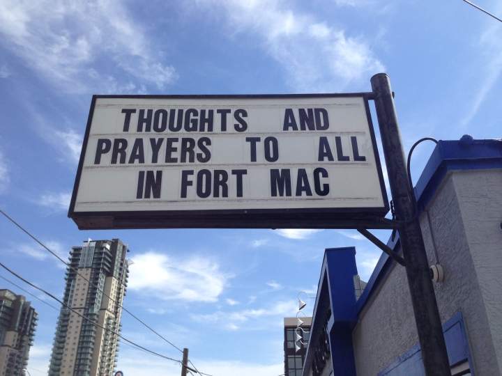 Sign outside Economy Glass in Calgary