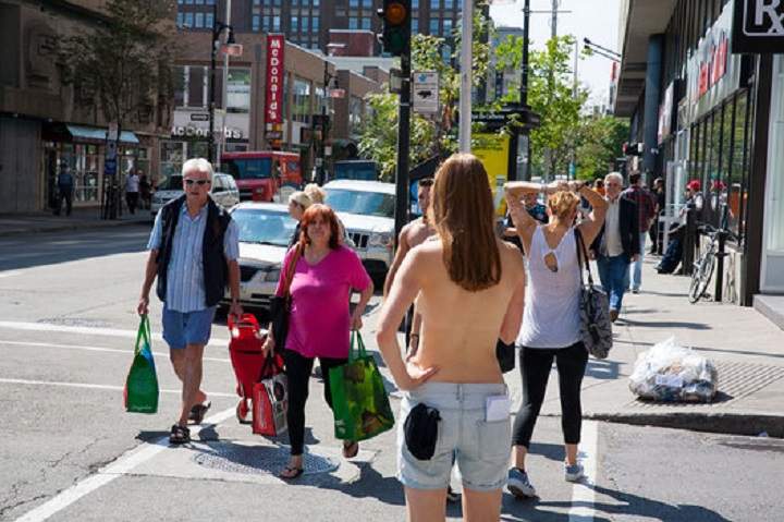 Journalist Lili Boisvert walked around downtown Montreal topless to see what people would do and say, 2014.