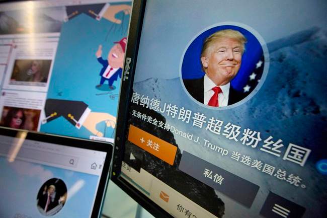 In this May 18, 2016 photo, Chinese fan websites for Donald Trump are displayed on a computer with the words "Donald J. Trump super fan nation, Full and unconditional support for Donald J. Trump to be elected U.S. president" in Beijing, China.