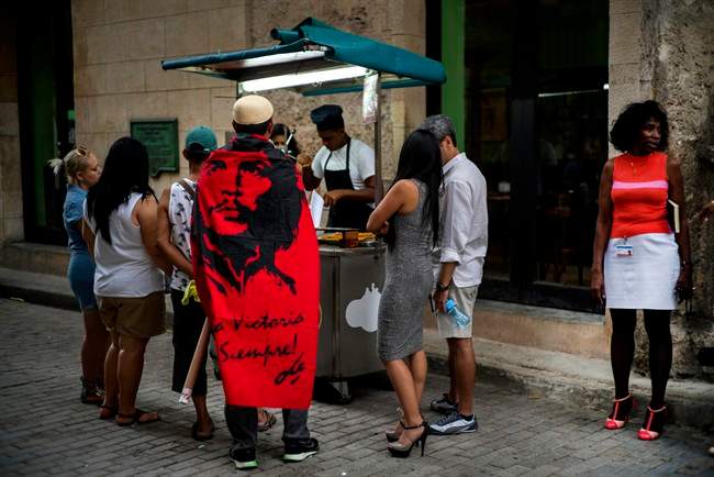 A street stall selling churros in Havana, Cuba, Monday, May 23, 2016.