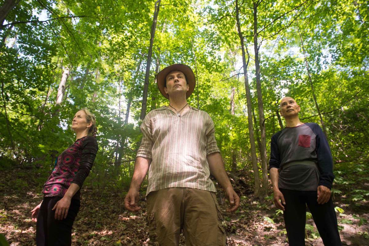 Ben Porchuk, center, head of the Canadian chapter of the Association of Nature and Forest Therapy Guides and Programs, poses with Ruthanne Henry, left, and Real Eguchi during a session of forest therapy at Sunnybrook Park, in Toronto, on Friday, June 3, 2016.  