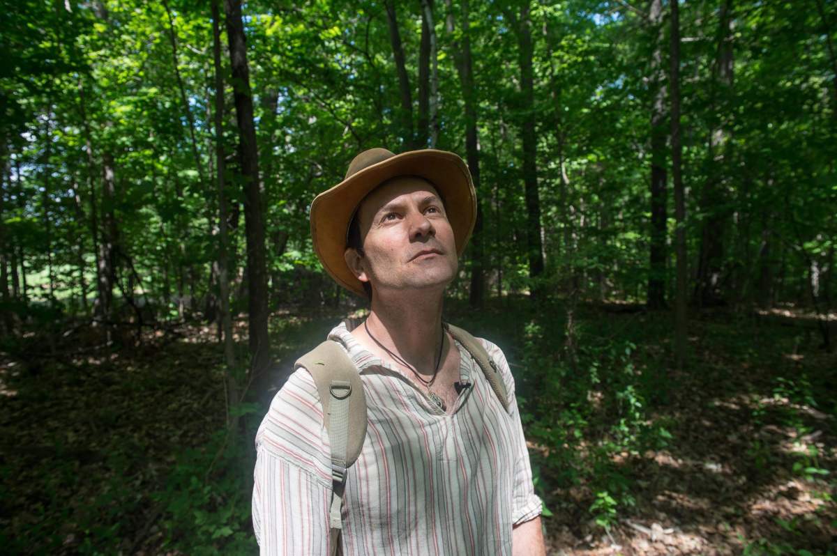Ben Porchuk, head of the Canadian chapter of the Association of Nature and Forest Therapy Guides and Programs, poses during a session of forest therapy at Sunnybrook Park, in Toronto, on Friday, June 3, 2016.