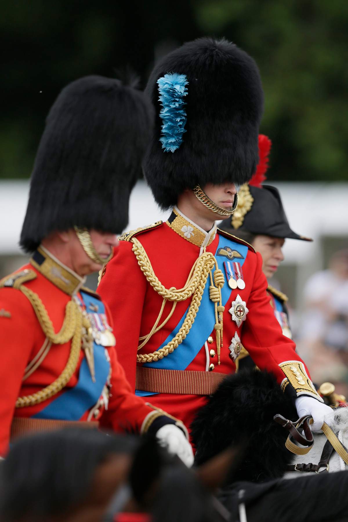 Britain’s Prince William, centre, rides a horse, during the Trooping The Colour parade at Buckingham Palace, in London, Saturday, June 11, 2016, with Prince Charles, left, and Princess Anne the Princess Royal, right. ()