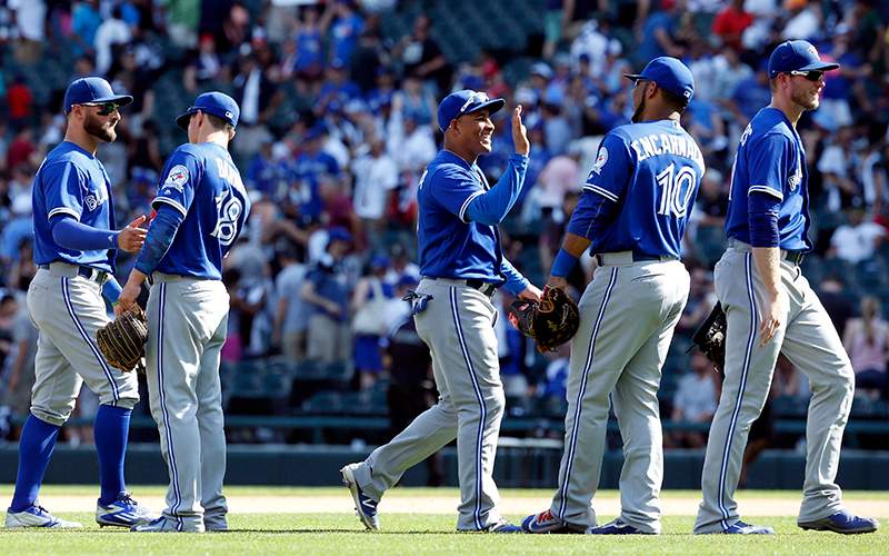 Toronto Blue Jays players celebrate after they defeated the Chicago White Sox 10-8 in a baseball game in Chicago, Saturday, June 25, 2016. 
