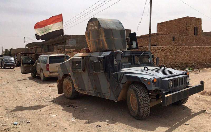Iraqi security forces patrol after defeating Islamic State militants in Fallujah, Iraq, Sunday, June 26, 2016. 