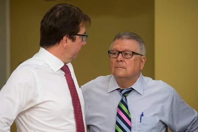Treasury Board President Scott Brison (left) speaks with Public Safety and Emergency Preparedness Minister Ralph Goodale before appearing before the National Security and Defence Committee in Ottawa, on Monday, June 6, 2016.