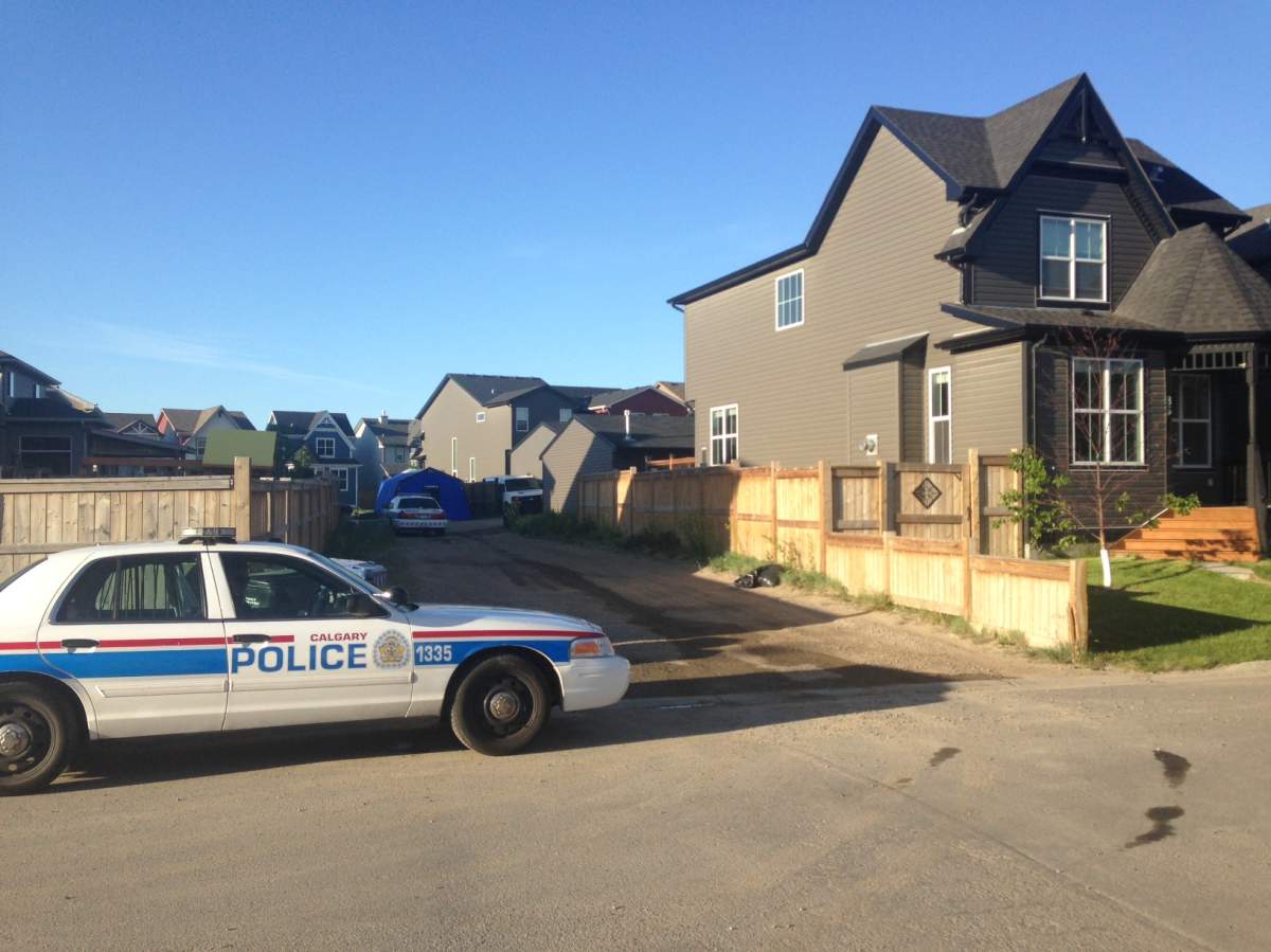 Police investigate a home along Autumn Terrace S.E. on Monday, June 6, 2016.