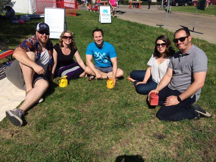 David Bayda and his friends pose for a picture after painting Pride Bench.