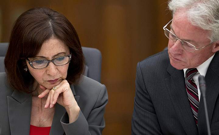 Information and Privacy Commissioner Brian Beamish is seen with former commissioner Ann Cavoukian during questioning at a legislative committee probing the gas plant scandal June 25, 2013 in Toronto. 