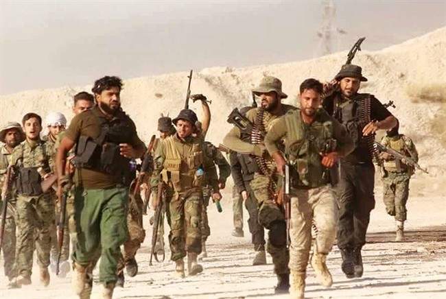 U.S.-backed Syrian rebels run in an unknown place in Syria, June 28, 2016.