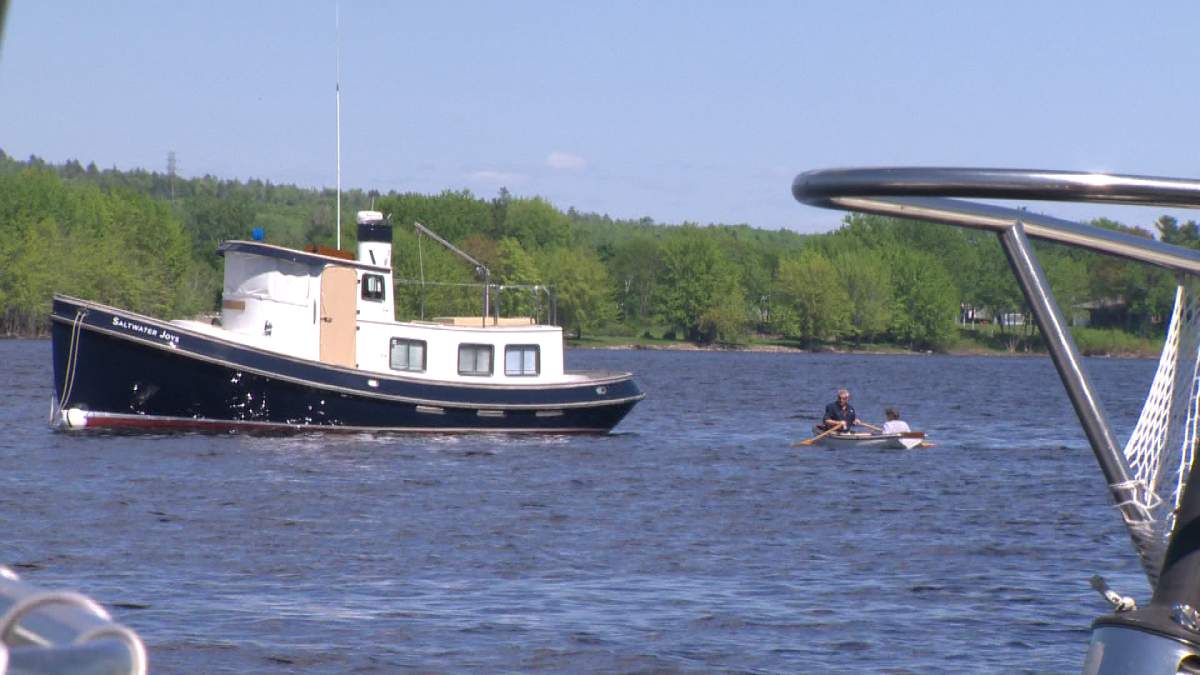 RCMP Assistant Commissioner Roger Brown and his brother, Wayne paddle out to Roger’s new boat and retirement plan, “Saltwater Joys.”