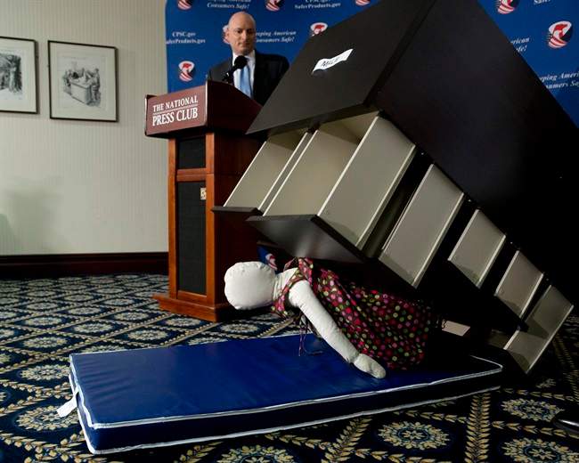 Consumer Product Safety Commission (CPSC) Chairman Elliot Kaye watches a demonstration of how an Ikea dresser can tip and fall on a child during a news conference at the National Press Club in Washington, Tuesday, June 28, 2016.