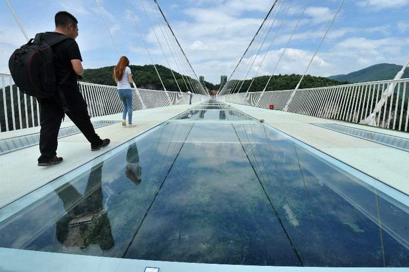 The glass bridge at the Grand Canyon of Zhangjiajie National Forest Park, central China’s Hunan Province; June 23, 2016.