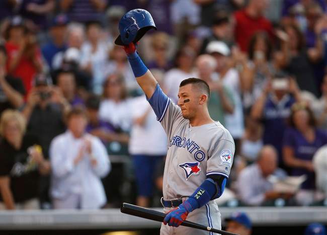Toronto Blue Jays' Troy Tulowitzki acknowledges the ovation form the crowd as he steps into the batter's box against the Colorado Rockies in the second inning of a baseball game Monday, June 27, 2016, in Denver. Tulowitzki was making his first appearance in Denver since being traded by the Rockies to Toronto last July.
