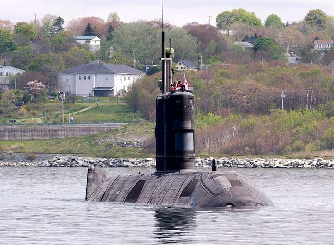 HMCS Windsor, one of Canada's four Victoria-class submarines, heads out the harbour in Halifax on Thursday, May 26, 2016.