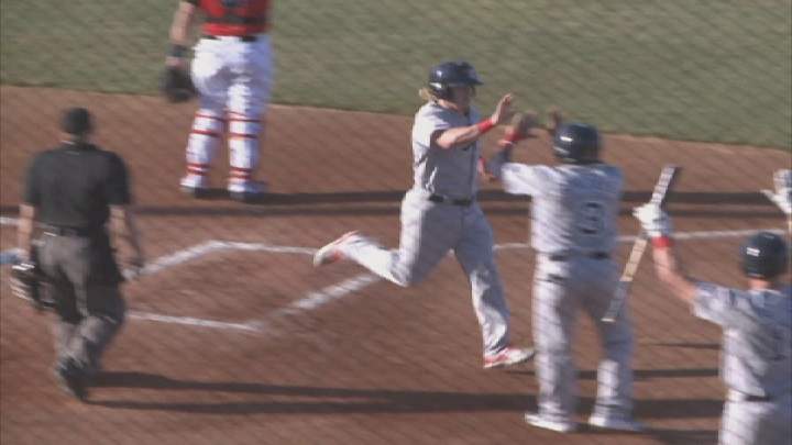 Winnipeg Goldeyes' outfielder Josh Romanski gets high fives after scoring a run on Tuesday in Sioux City.