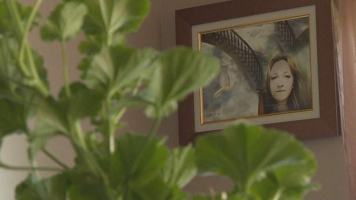 A painting of Samantha Higgins hangs on the wall in her mother's home. Thursday, June 16, 2016.
