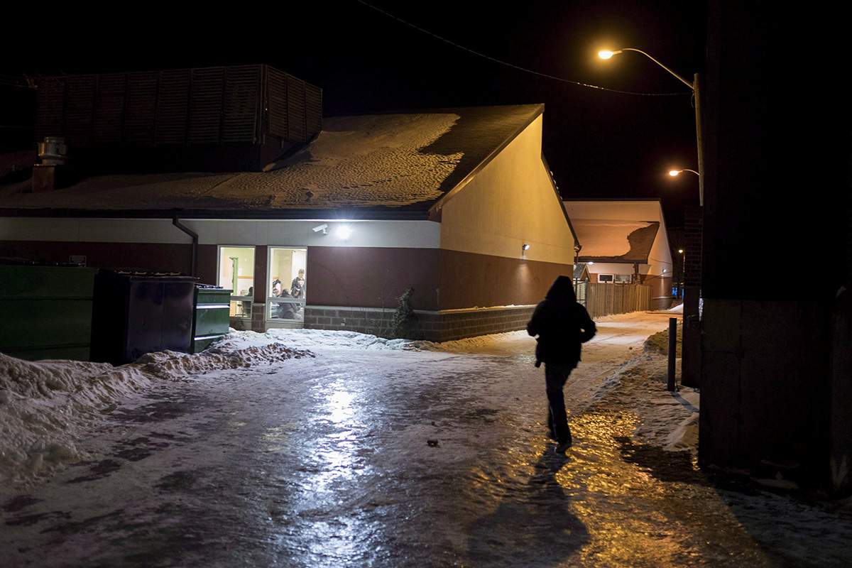 A homeless man walks up to Shelter House for dinner in Thunder bay, Ont., , Thursday, March 3, 2016. 