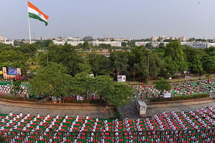 Indian yoga practitioners participate in a mass yoga session on International Yoga Day in New Delhi on June 21, 2016.