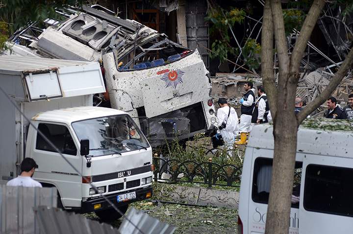 Turkish police officers work at the scene of a blast just after an explosion in Istanbul, Tuesday, June 7, 2016.