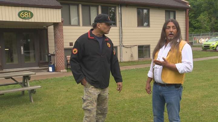 Weniente (left) and Kanesatake Grand Chief Serge Otsi Simon argue about a proposed mining project, Thursday, June 2, 2016.