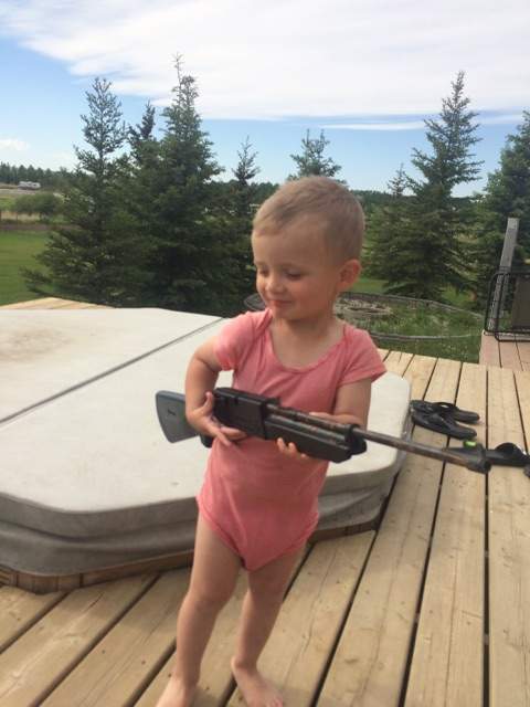 Photos of 2-year-old Alberta boy holding gun cause viral stir - image