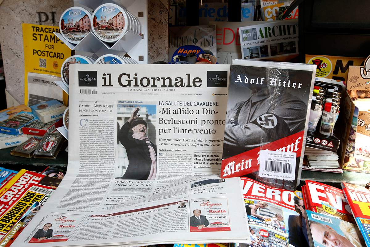 Il Giornale newspaper is seen on sale in a newsstand with Hitler's "Mein Kampf", in Rome Saturday, June 11, 2016.