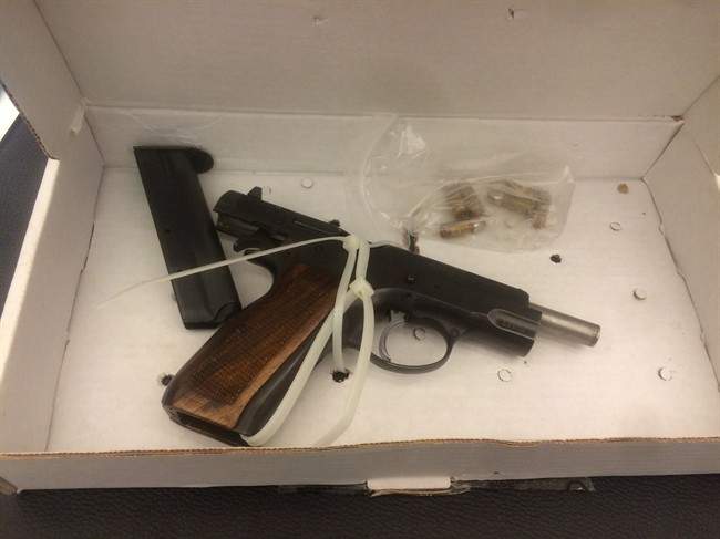 A photo of a gun released as evidence at the Richard Henry Bain trial in Montreal is shown in a court exhibit photo.