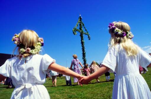 Midsummer dance around a maypole