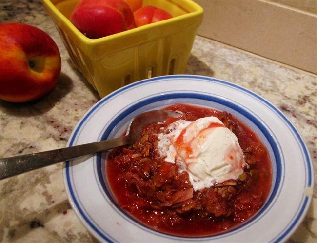 This May 30, 2016 photo shows a quick stone fruit crumble in New York.