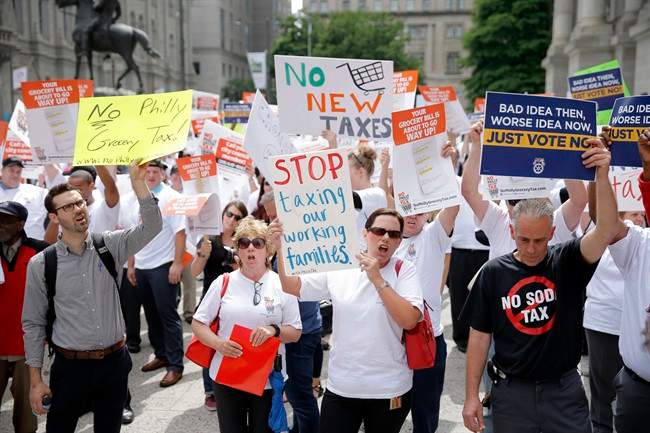 Opponents of a proposed sugary drink tax demonstrate outside City Hall in Philadelphia, Wednesday, June 8, 2016. 
