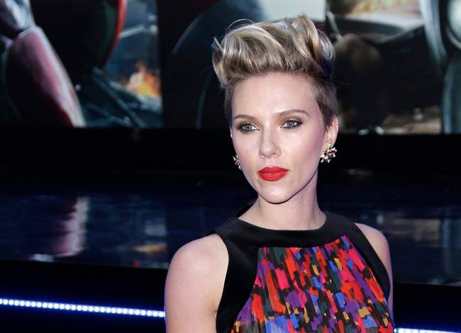 In this April 21, 2015, file photo, Scarlett Johansson poses for photographers upon arrival at the premiere for the film 'The Avengers Age of Ultron' in London.