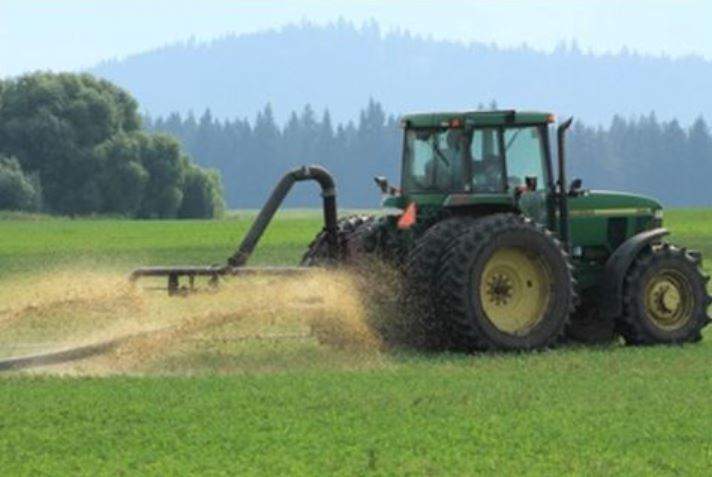 Liquid manure being sprayed on field above drinking water aquifer.