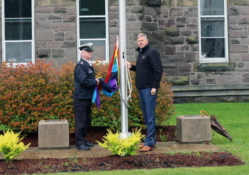 New Brunswick Deputy Premier Stephen Horsman raises the Pride flag at the provincial legislature on Monday, June 13. 