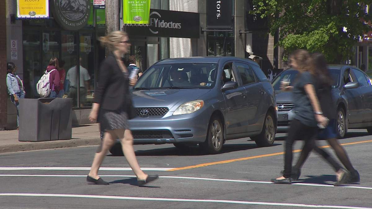 Pedestrians cross Spring Garden Road on Thursday, June 1, 2016. 
