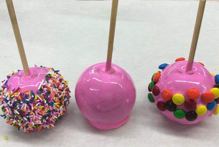 Pink strawberry flavoured candy apple