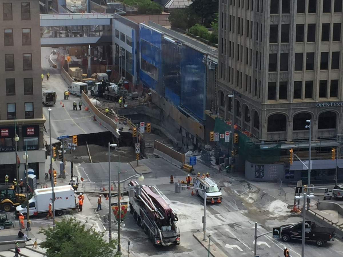This image of the sinkhole at the corner of Sussex Drive and Rideau Street in downtown Ottawa was taken on Thursday, June 9, 2016. Crews were working to fill the hole with concrete.