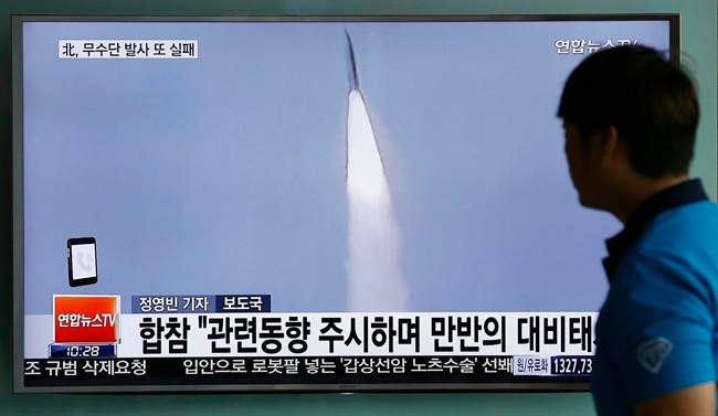 In this May 31, 2016, file photo, a man watches a TV news program reporting about a missile launch of North Korea, at the Seoul Train Station in Seoul, South Korea.