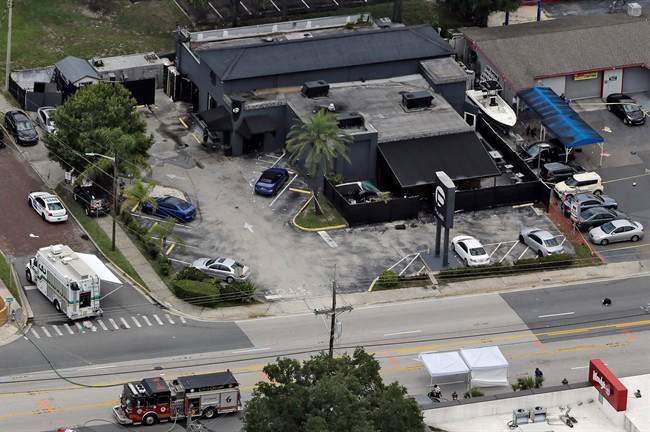 In this June 12, 2016 file photo, law enforcement officials work at the Pulse nightclub following a fatal shooting, in Orlando, Fla. 